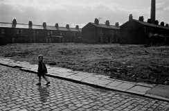 Child crossing wasteground, Salford, 1969 