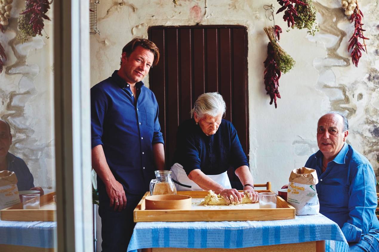 Oliver with Gennaro Contaldo (right) and one of the Italian nonnas whose cooking has informed his latest book and series as well as restaurant menus at Jamie’s Italians